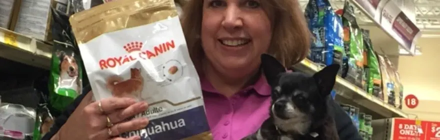 woman holding chihuahua and dog food