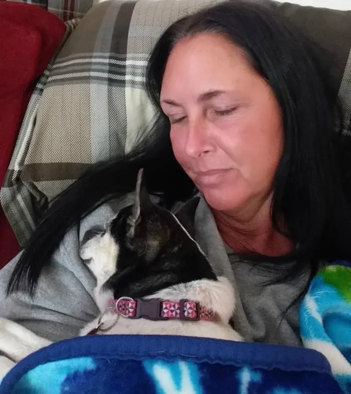 woman holding a chihuahua