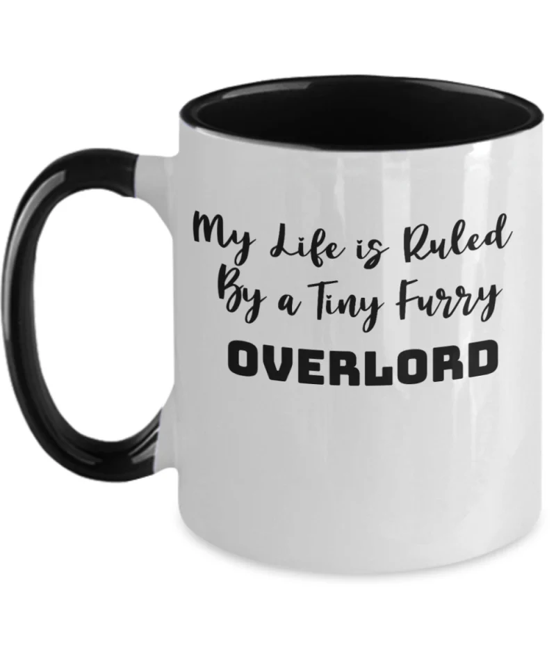 White mug with black handle says My Life is Ruled by a Tiny Furry Overlord