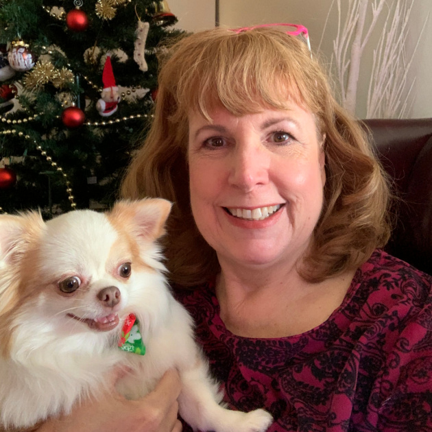 blond woman holding white chihuahua